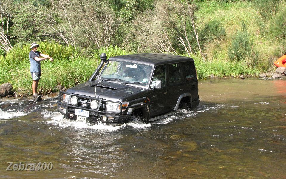 08-James brings his new Troopy through the Thomson.JPG